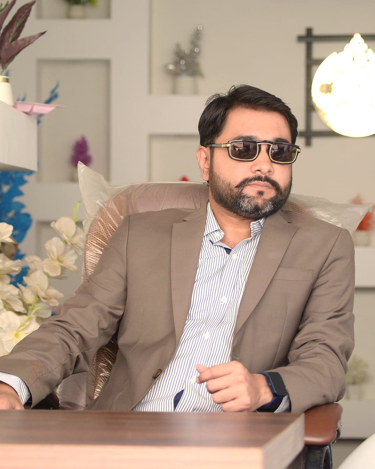Umair Anwer Baloch, Founder and Chief Executive Officer of Artivex Studio, at his desk